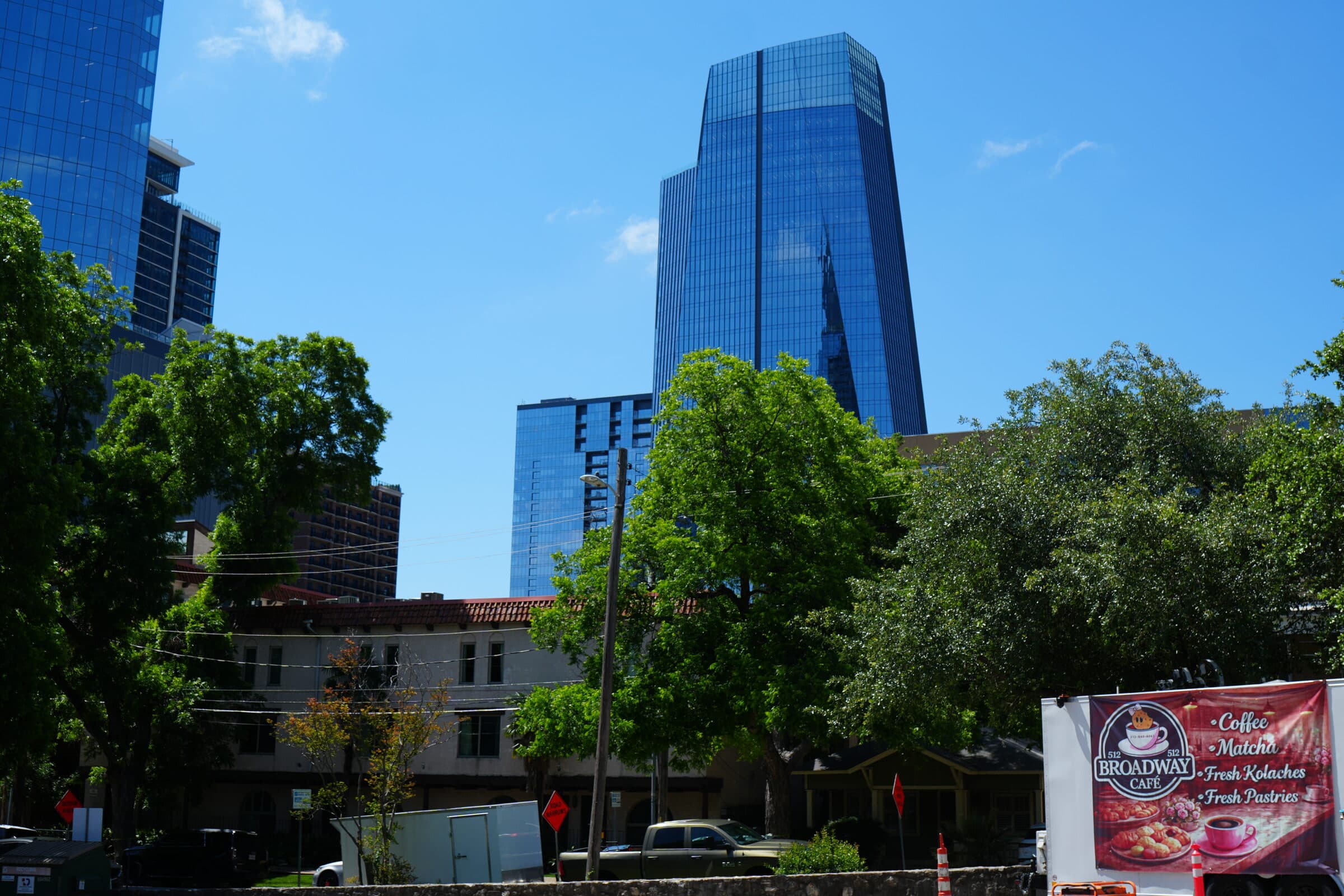 Downtown Austin skyline behind the ANW Parking lot and on-lot coffee truck
